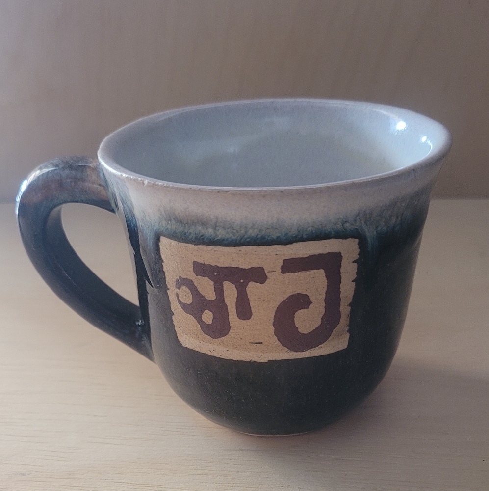 Handcrafted Ceramic Mug with Artistic Design